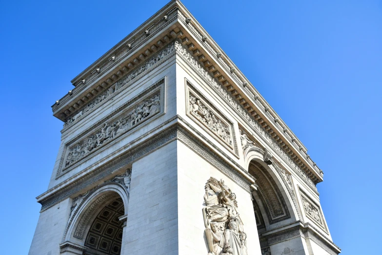 a monument in the middle of a blue sky