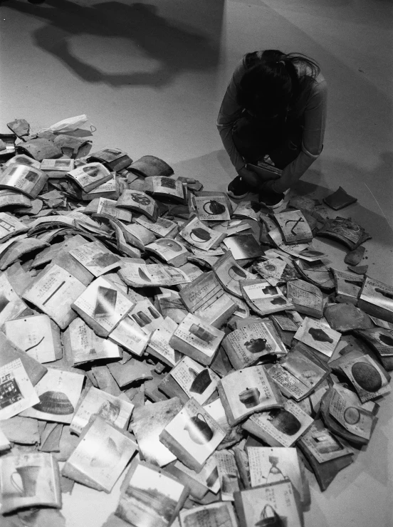 piles of currency on top of a table next to a baseball glove