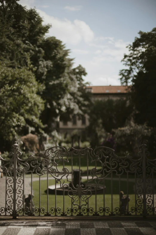 a black wrought iron fence in front of a building