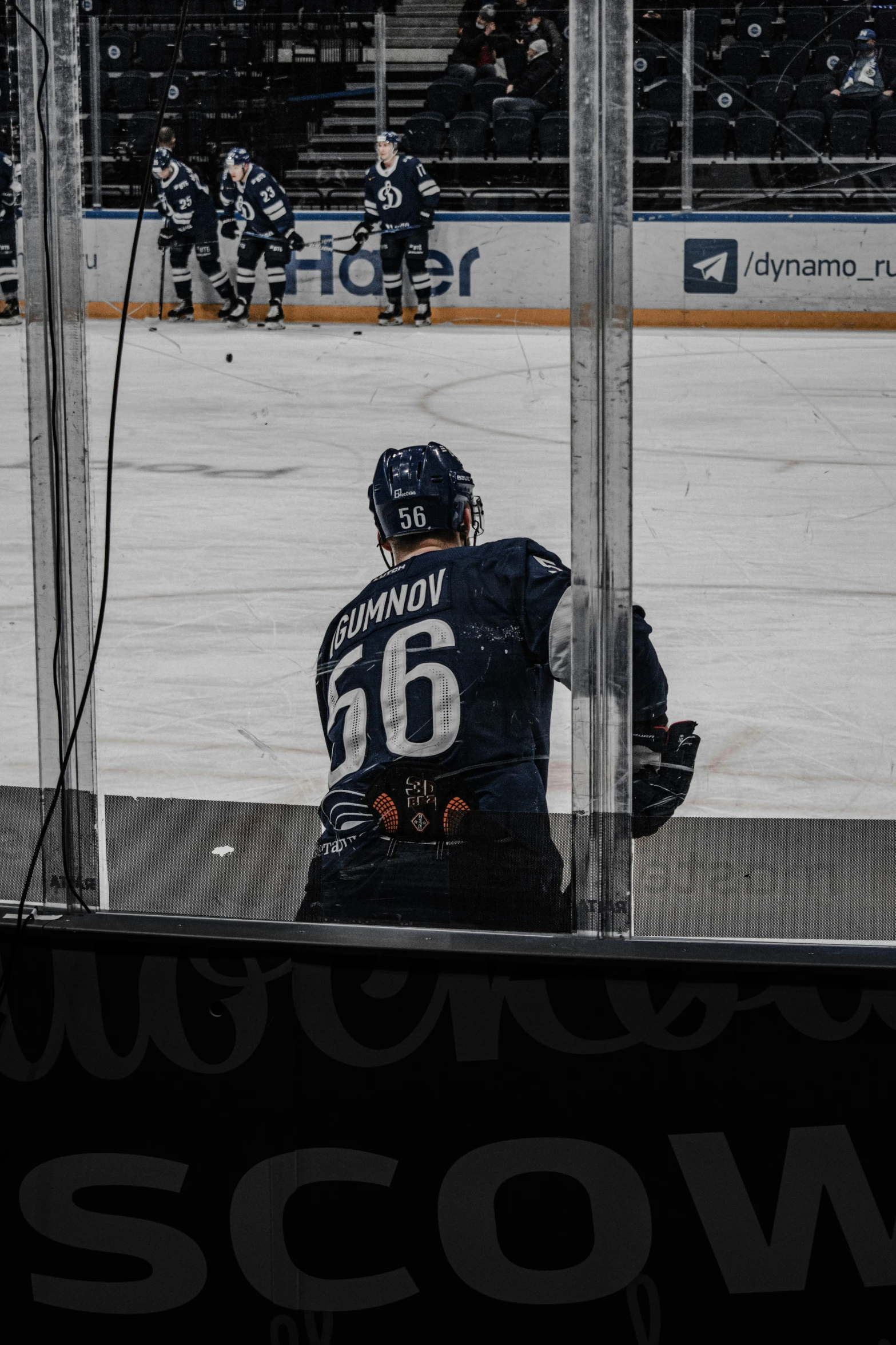 a person sitting in front of a window on the ice