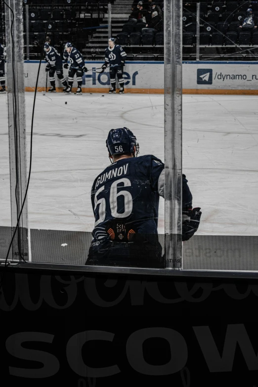 a person sitting in front of a window on the ice