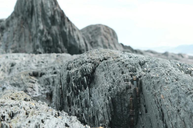 there is a large piece of rock in the middle of the desert