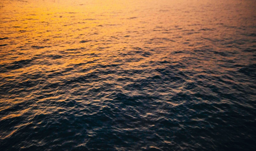 a beautiful view of an ocean at sunset