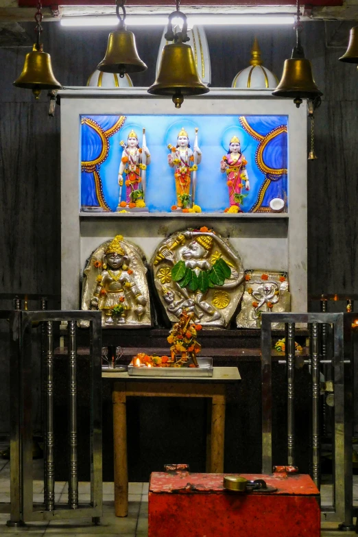 a small shrine with several items, and bells