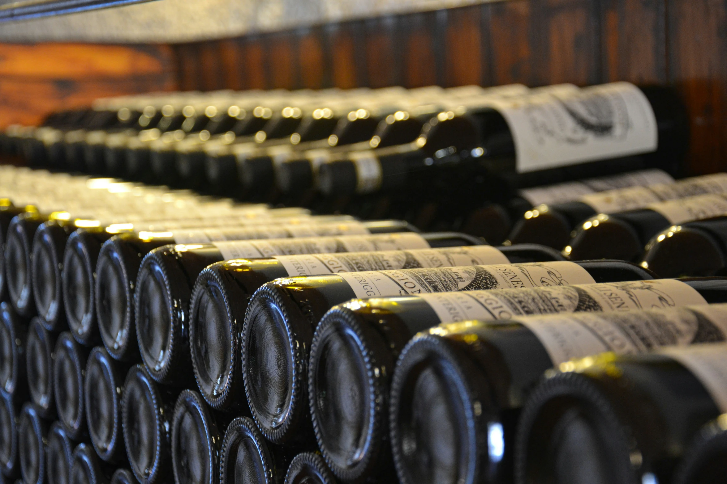 rows and rows of bottles of wine on display