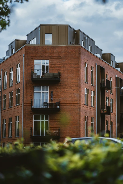 an apartment building with two balconies in front of it