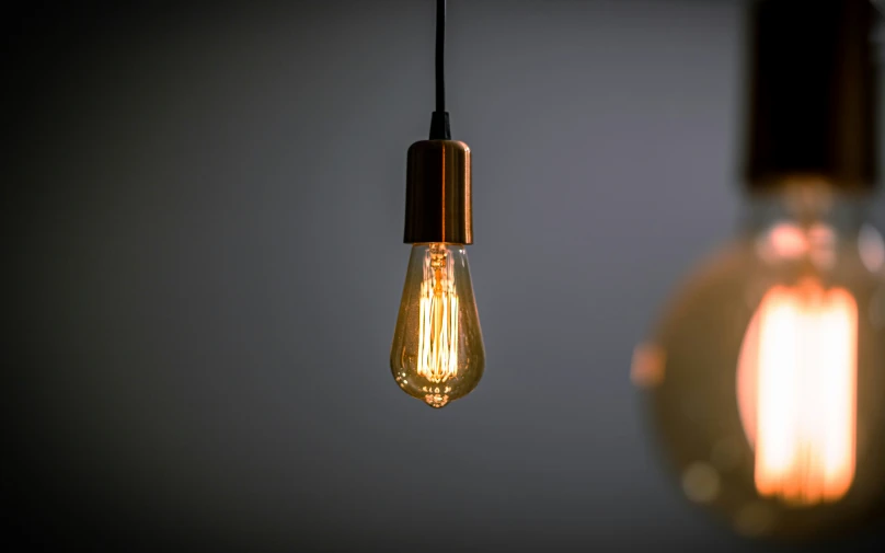 two light bulb and lightbulb hanging in the air