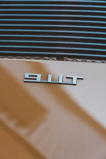 the logo of an automobile showing off the chrome