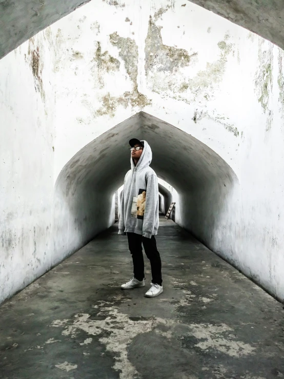 a man standing in an inner tunnel