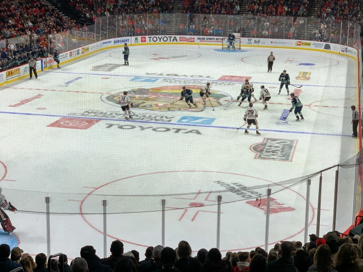 an overhead view of a hockey game during the day