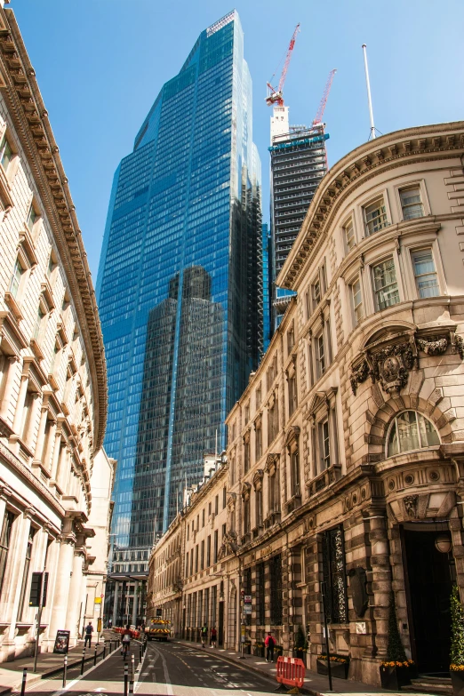 a street with tall buildings and traffic signs