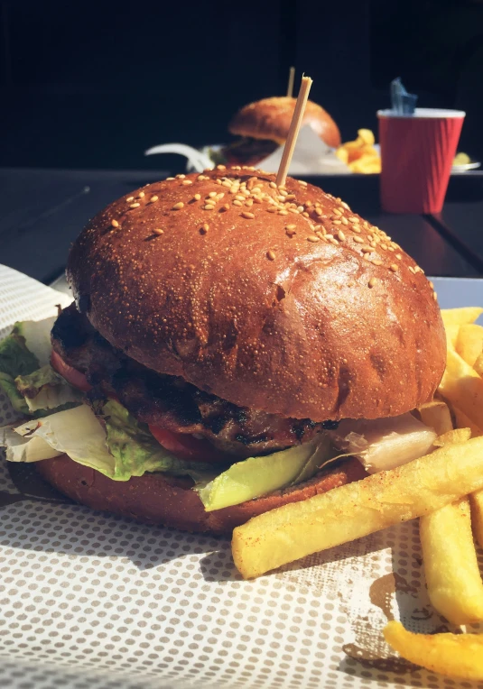 a sandwich on a white plate next to french fries