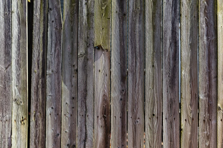 an old wooden fence with no one standing