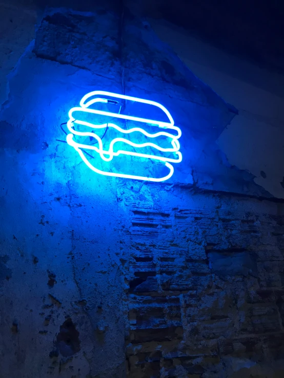 a neon sign in the middle of a building