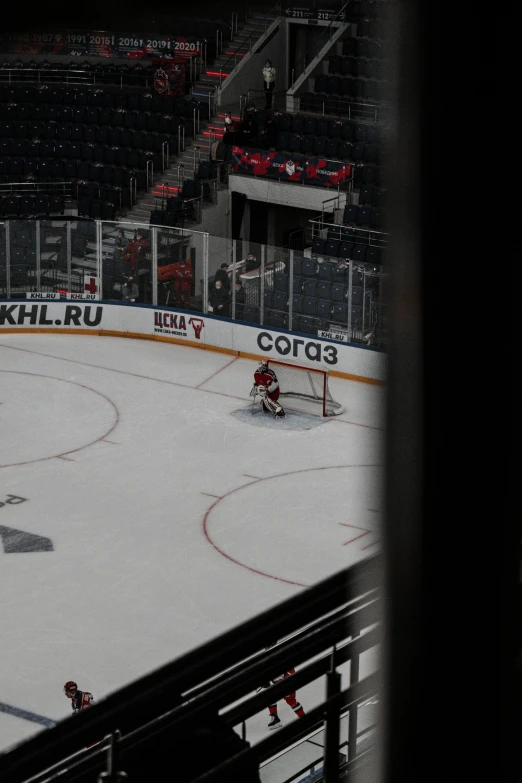 a hockey match being played at a large stadium