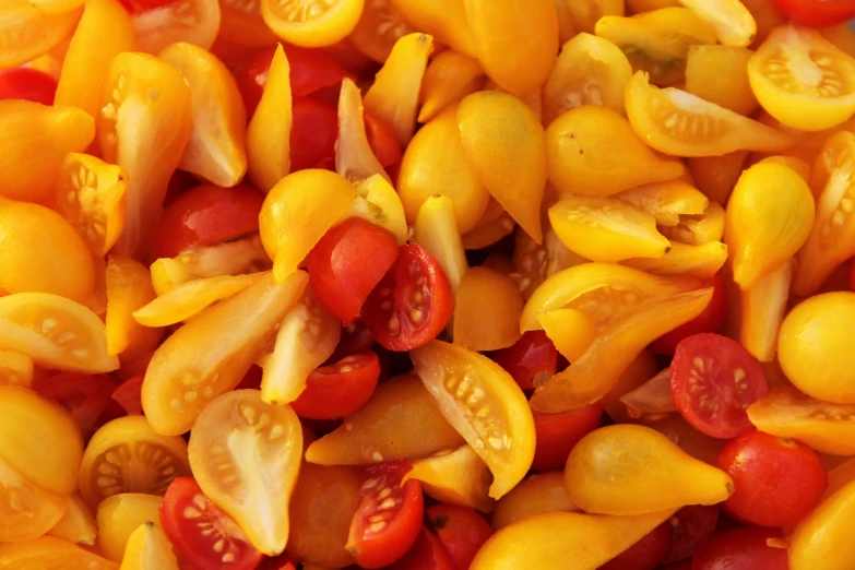 small and large bunch of yellow, red and orange fruit