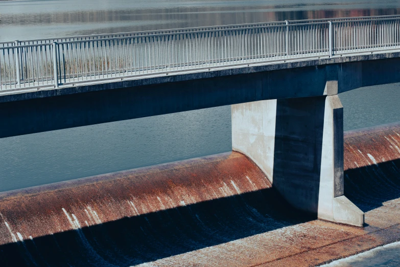 a bridge that has some water flowing under it