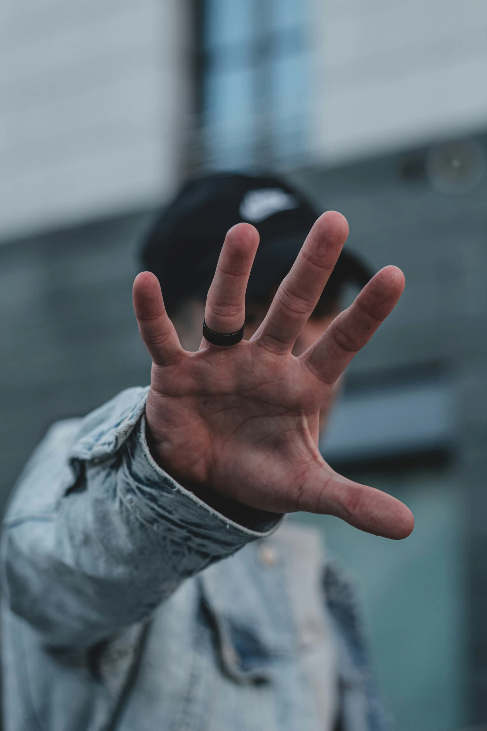 a person with their hands raised up, in the middle of the po