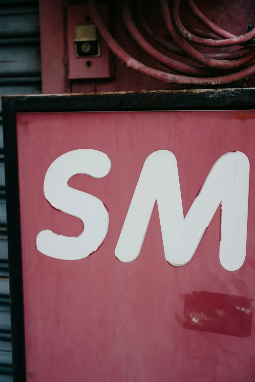 an image of the sm sign above a wall
