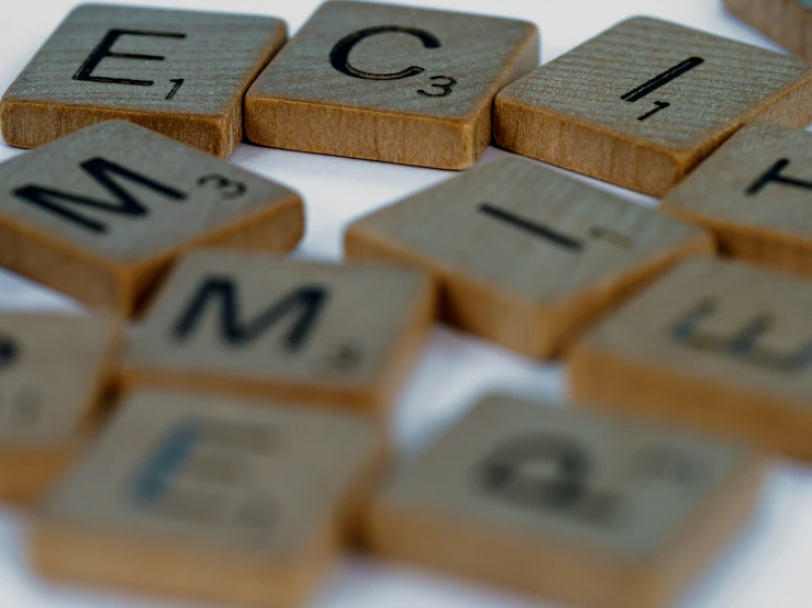 many wooden letters arranged on a table