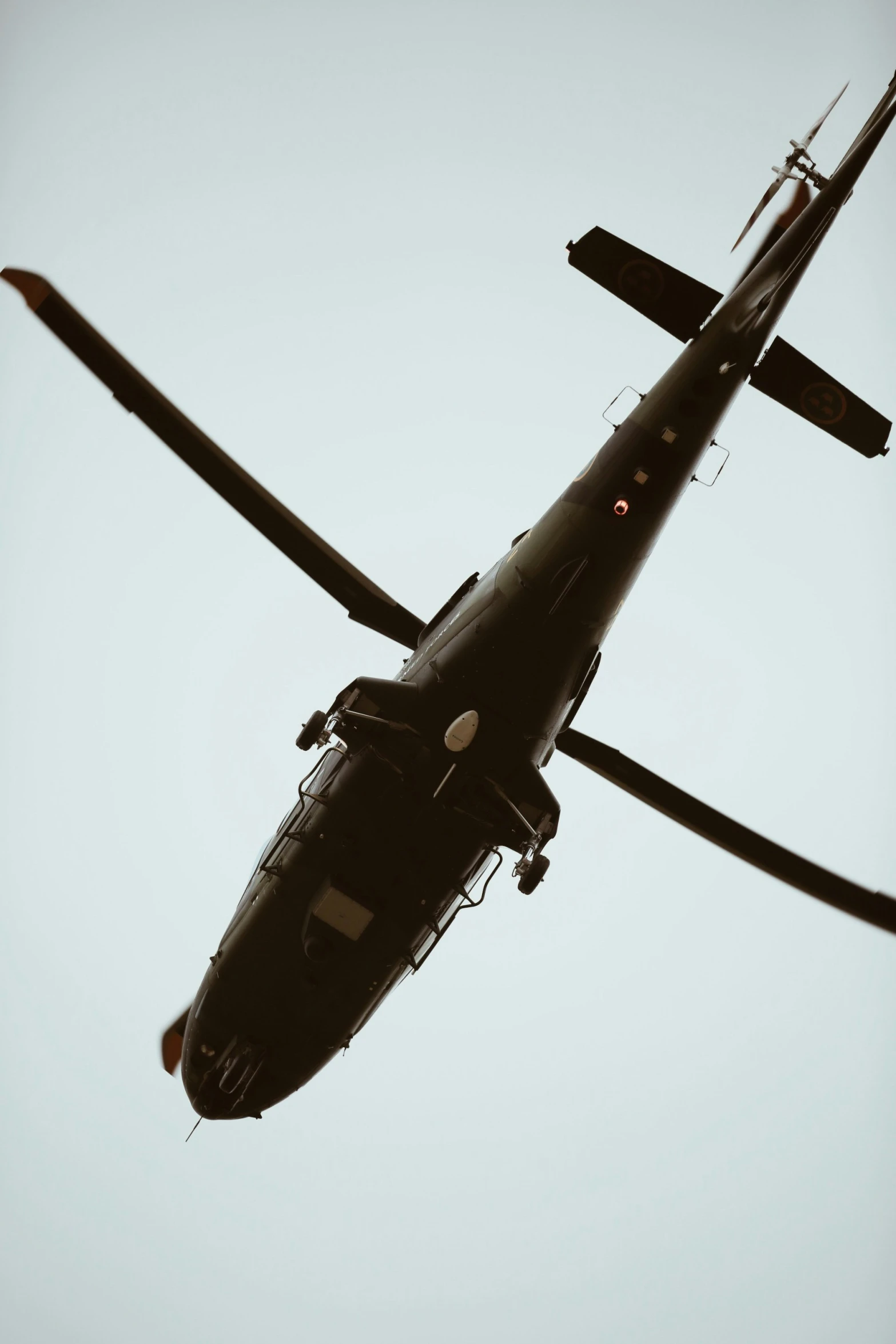 a helicopter flying in the sky on a clear day