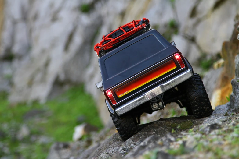 the back end of a toy truck with lights on