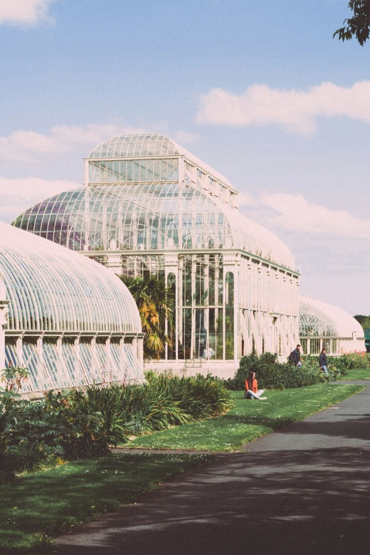 a green house with glass houses on both sides