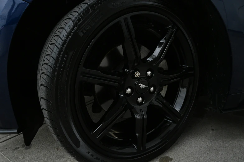 the wheel of a car that has a black rim