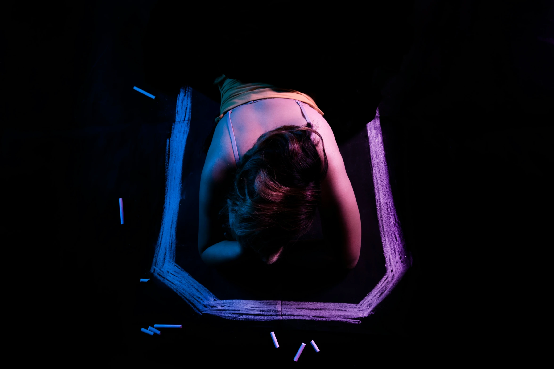 a person is seen with their hands on a laptop in the dark