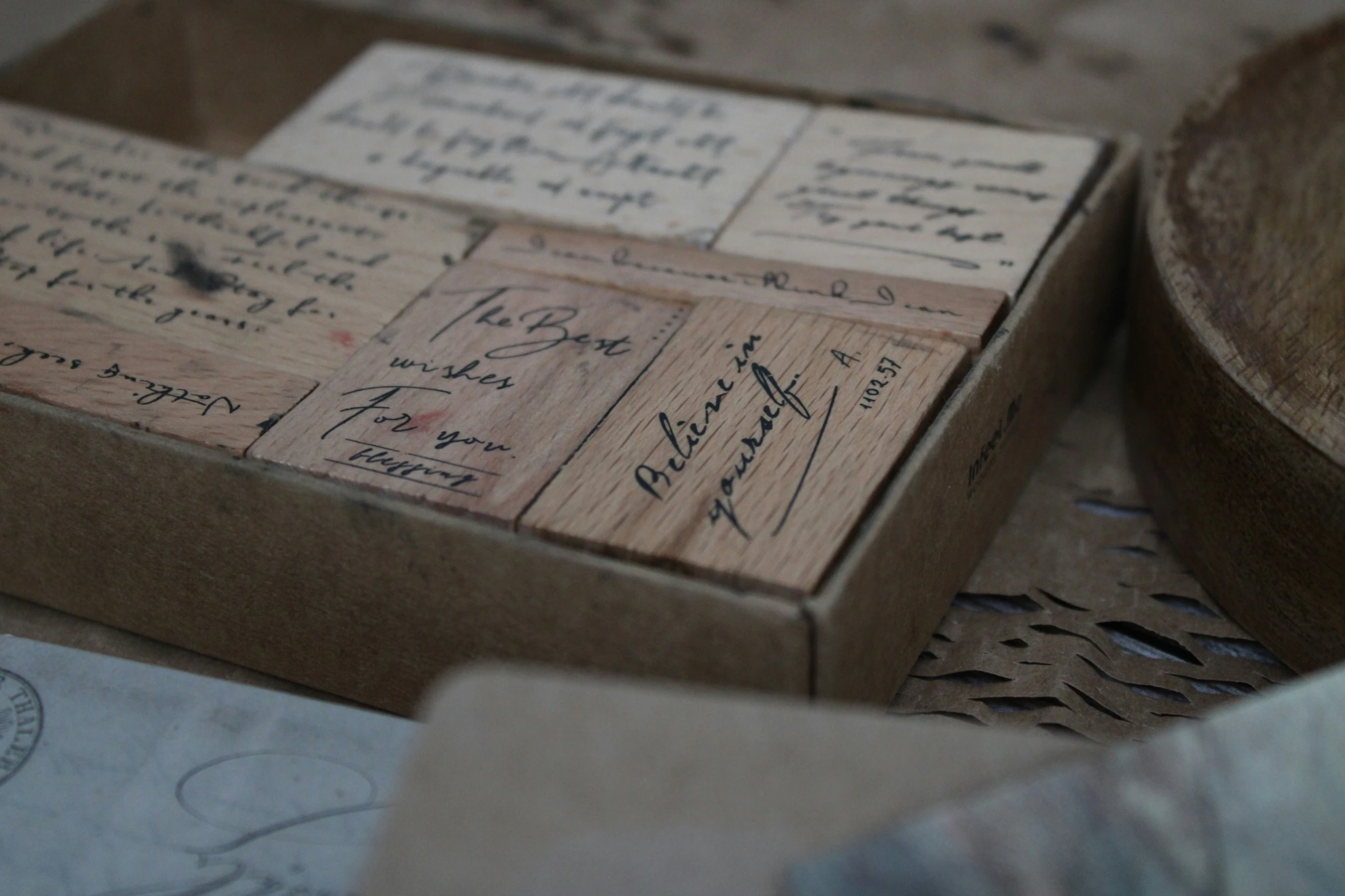 a wooden box that has many letters and writing on it