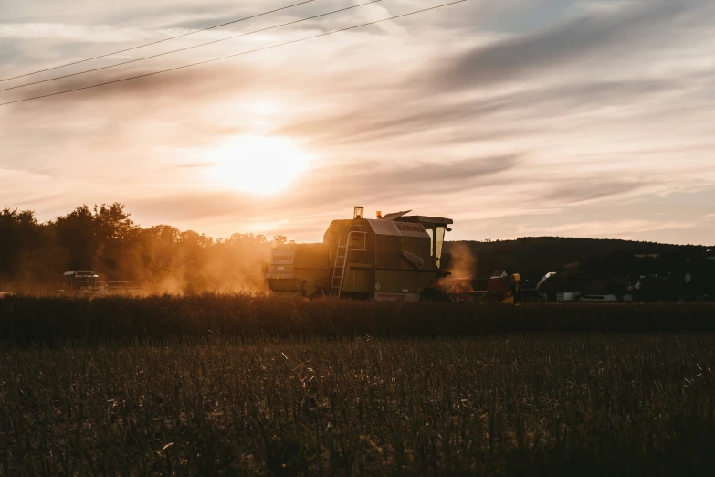 there is a tractor in the field working