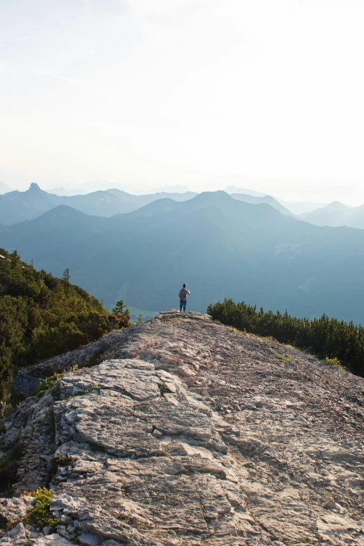 a hiker is on a mountain top