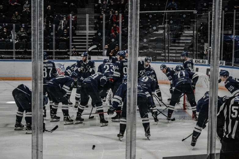 group of men playing hockey in the rain