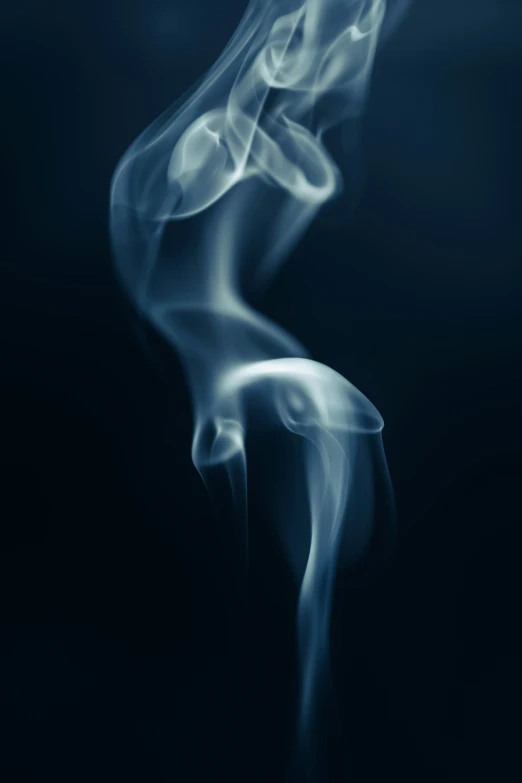 the smoke from a pipe is seen in this pograph