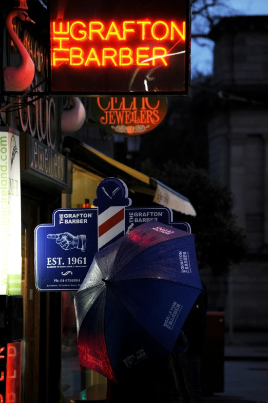 an umbrella is hanging outside of a bar