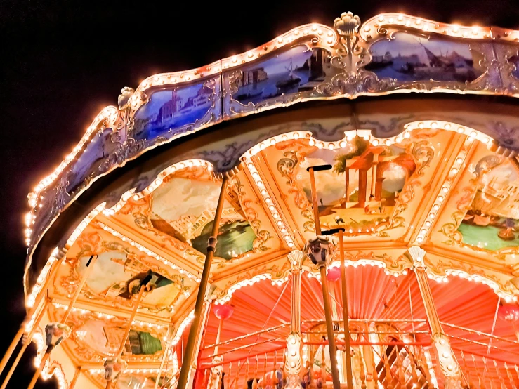 an amut carousel at night with its canopy open