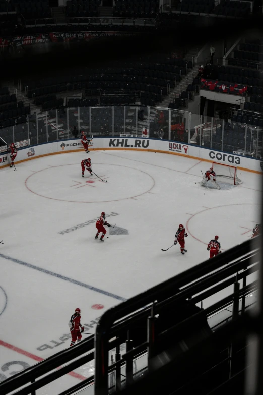 the men are playing hockey on the ice rink