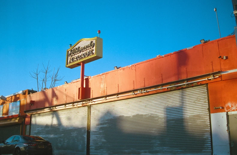 a store front with a yellow sign over the door