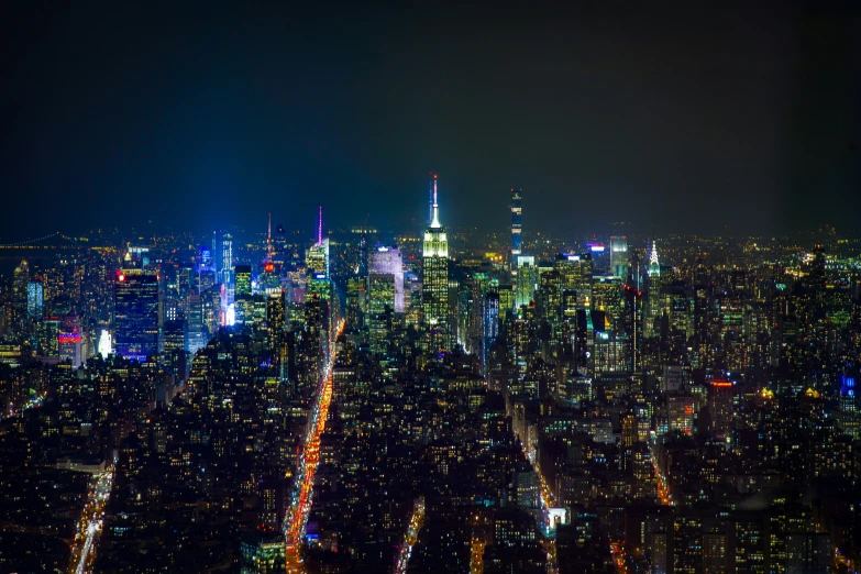 night time city lights shine in this aerial view