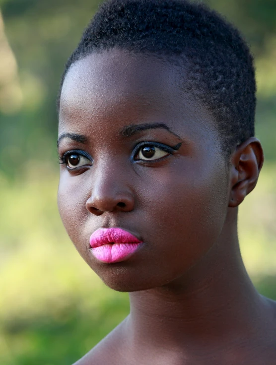 a  with a pink lip - ring and eyeshadow