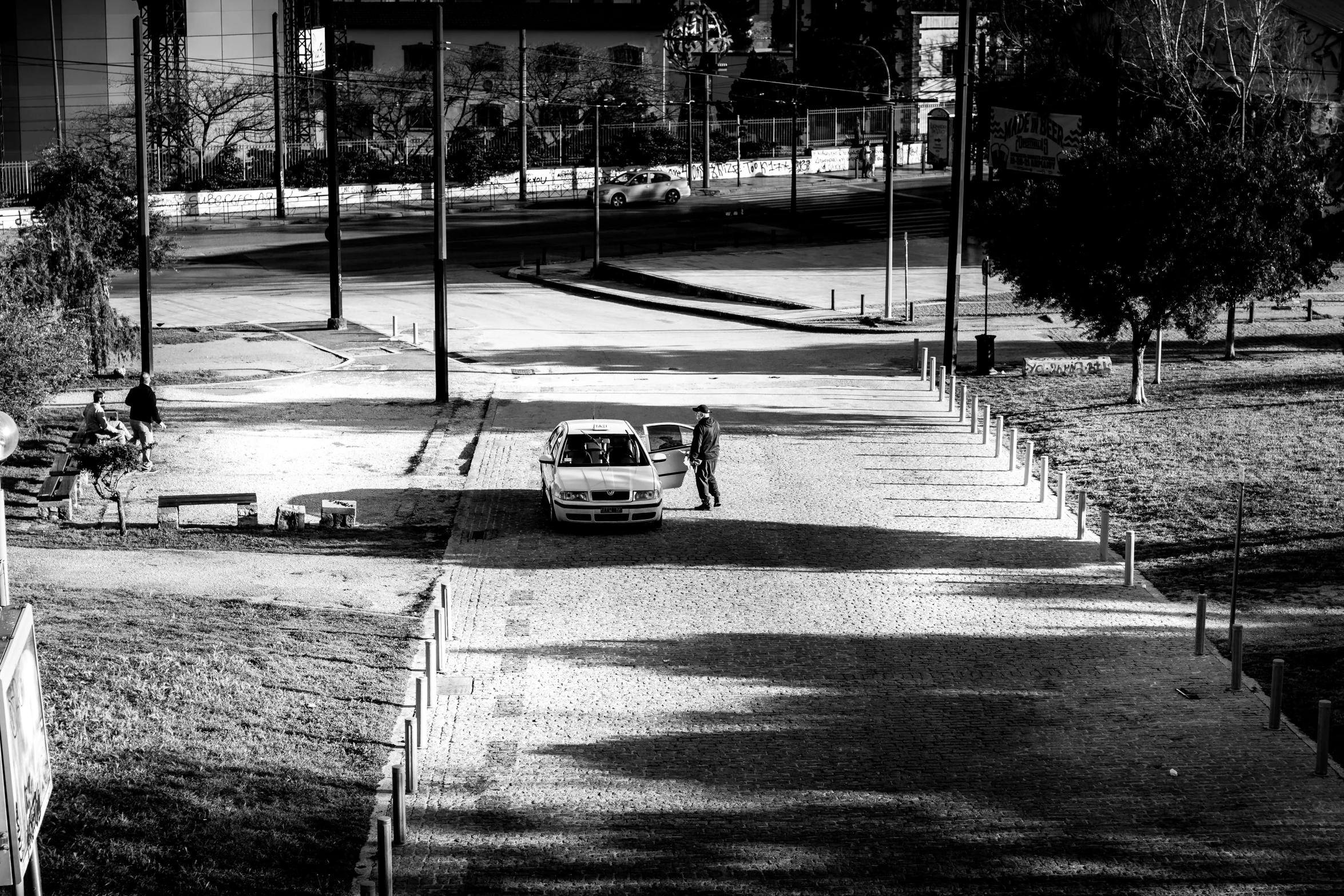 a car is parked on the side of a road at night