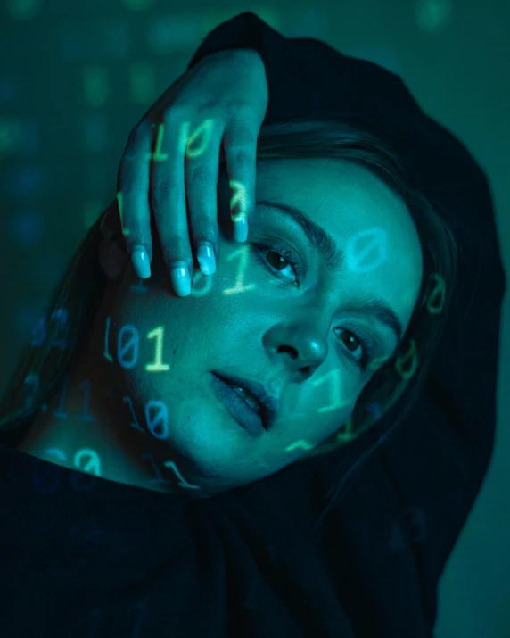 a woman is posing for the camera with numbers projected on her face