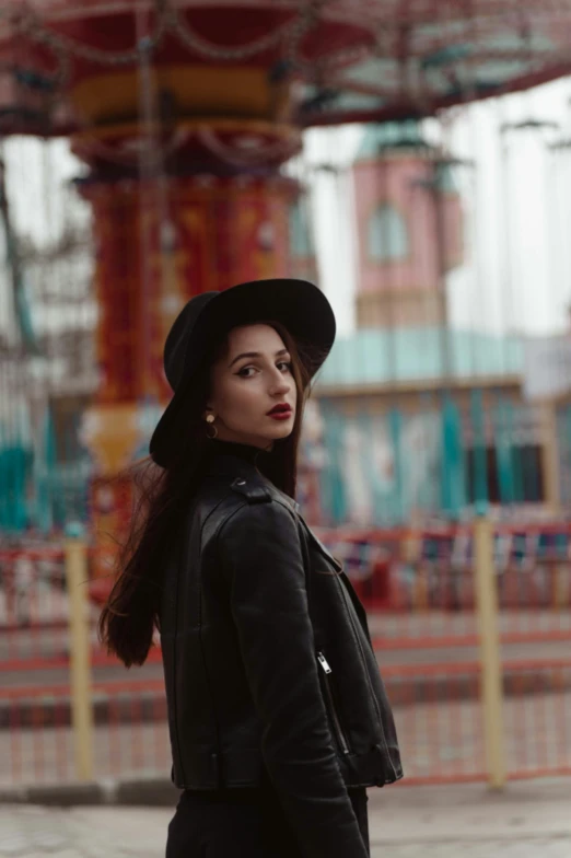 woman in black clothes with a hat on