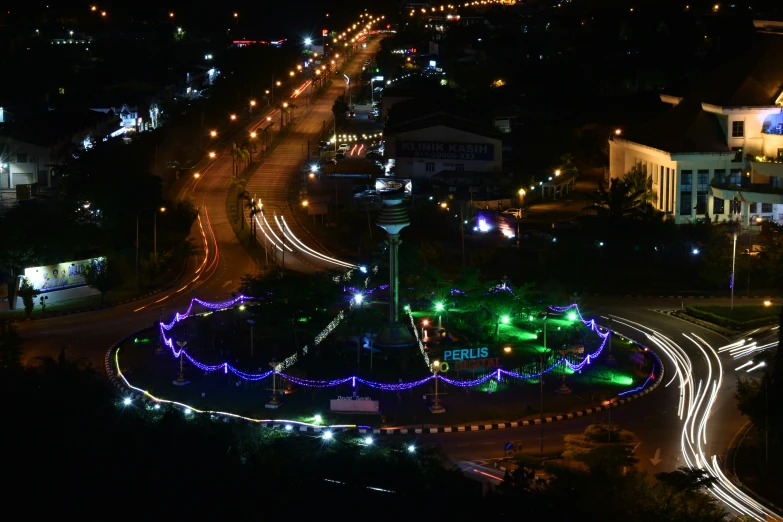 night time lights shine on a city street