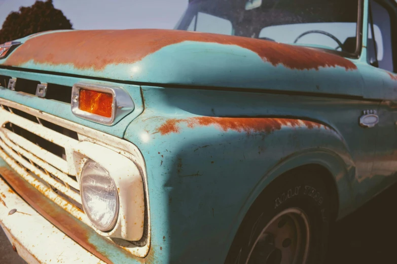 this is an old rusted out truck parked