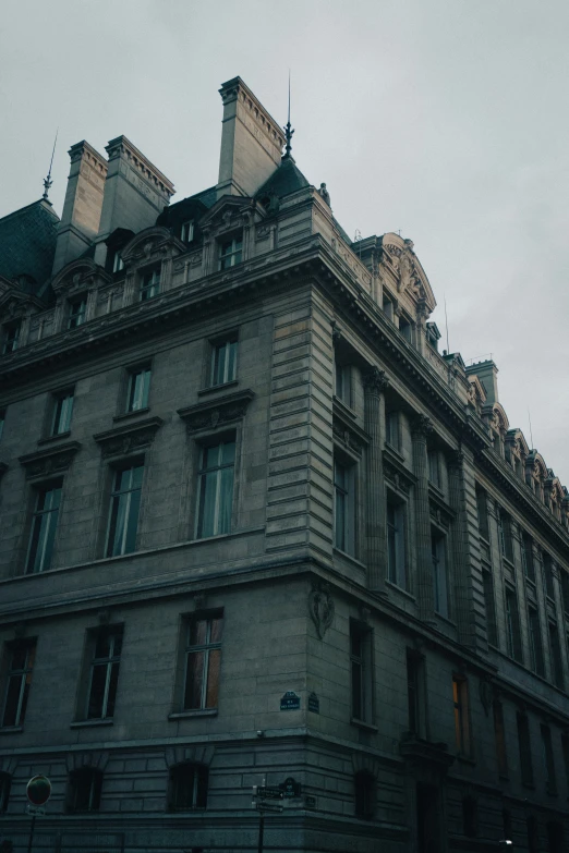 the top of a building has a steeple with windows