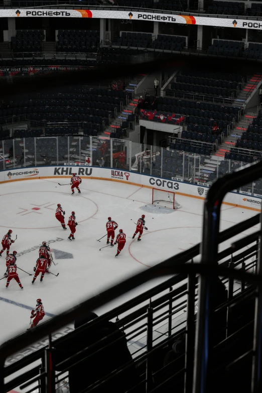 a group of people on a ice rink playing hockey