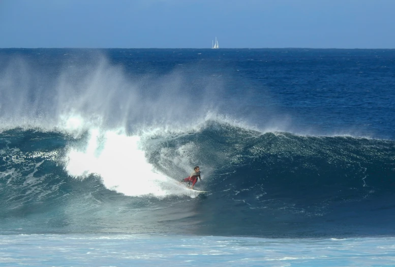 a surfer on the crest of a large wave