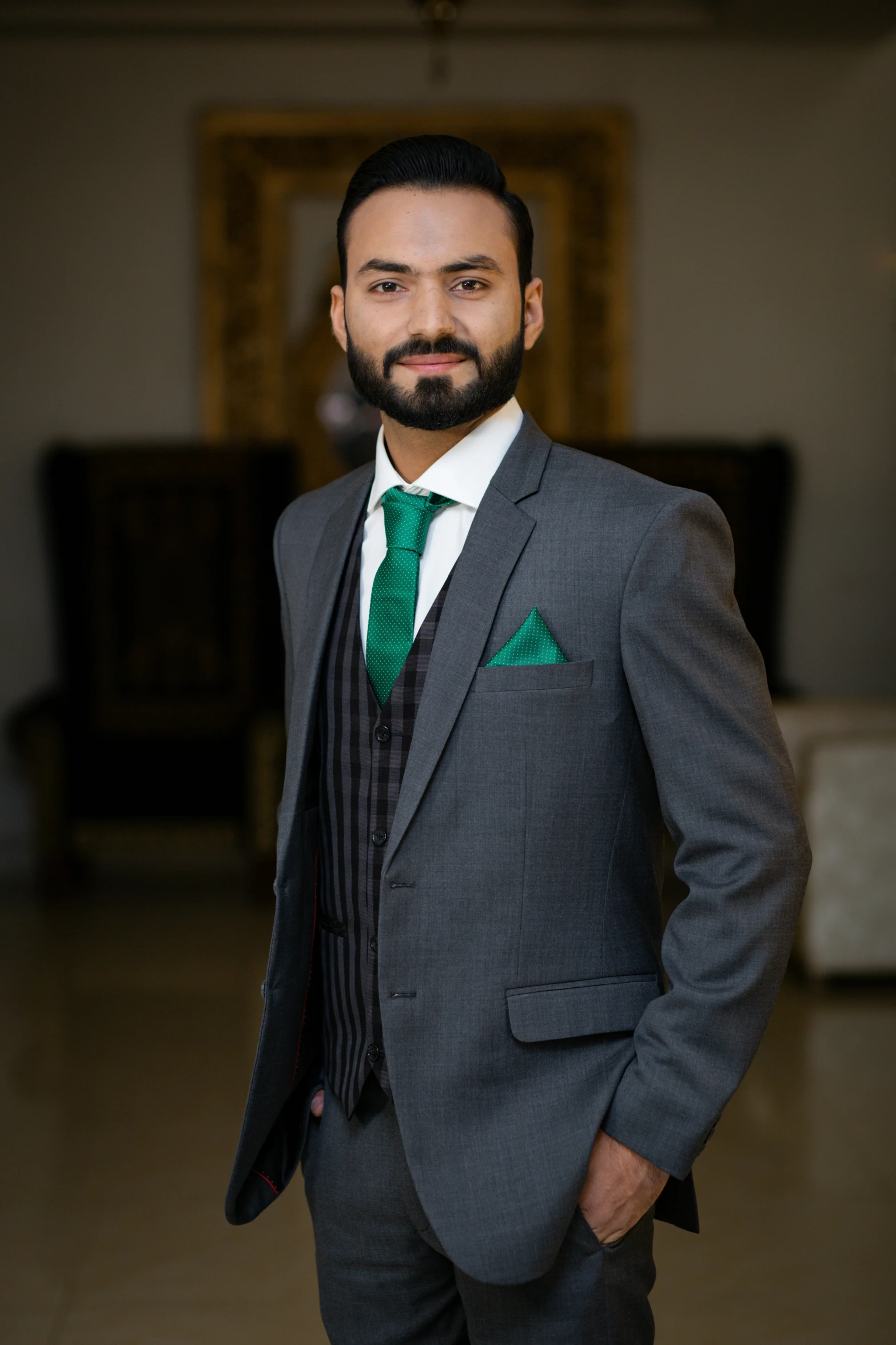 a man with a beard wearing a suit and tie