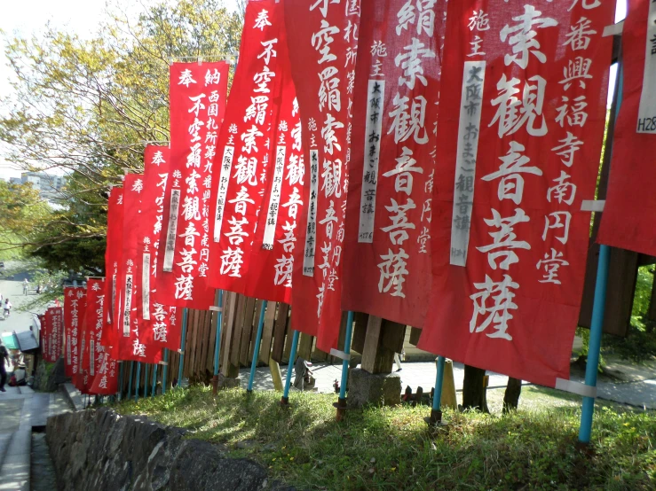 there are many red chinese flags lining the street